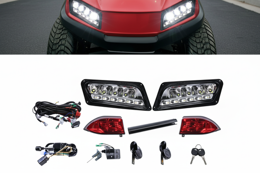 Candy apple red golf cart with illuminated headlights on pavement